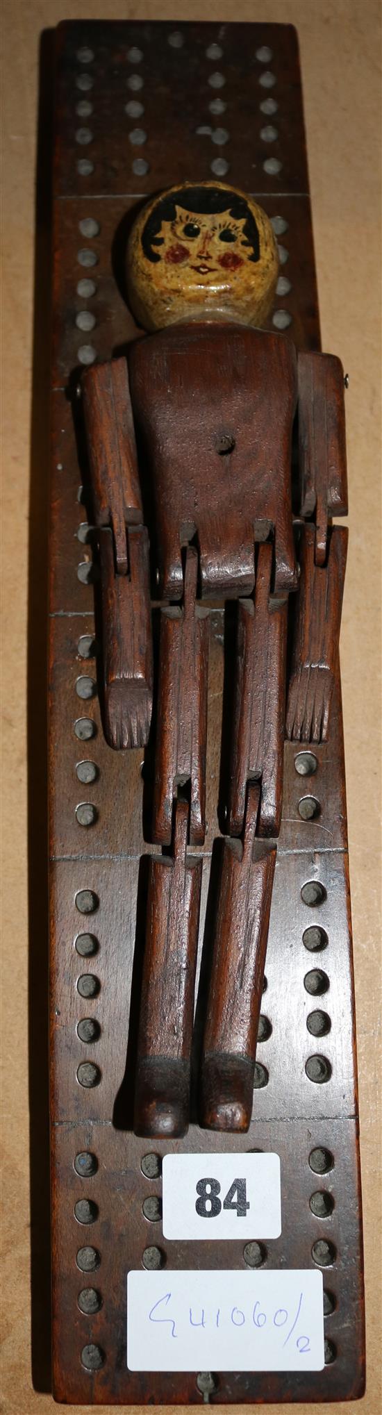 Cribbage board, articulated doll, painted falcon